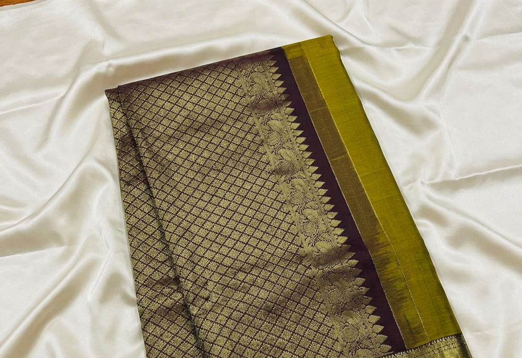 Rich mustard yellow Kachipuram Saree with a Brown border