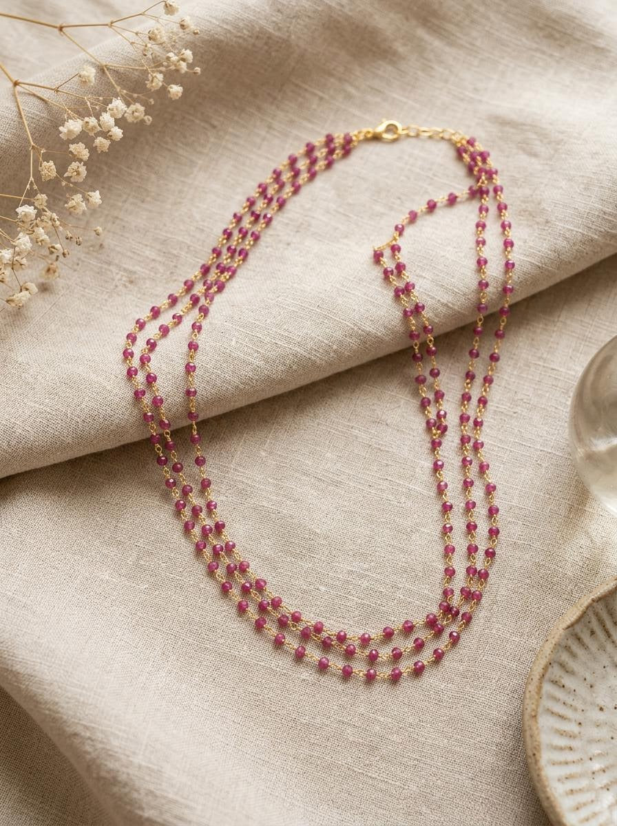 Three-strand bead and gold chain necklace