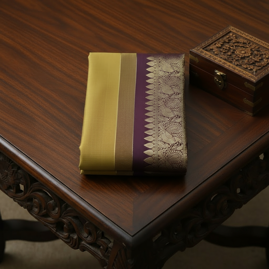 Rich mustard yellow Kachipuram Saree with a Brown border