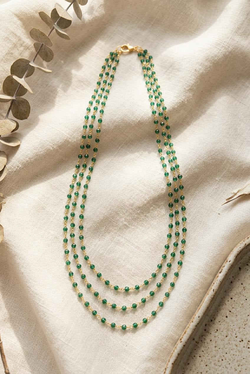 Three-strand bead and gold chain necklace