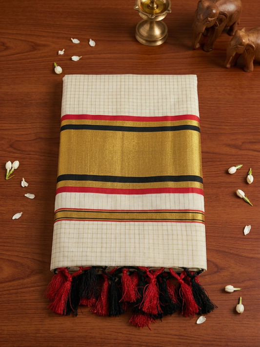 Off-White Cotton Saree with Subtle Micro-Checks, Broad Gold Zari Border, Striking Black and Red Striped Accents, and Hand-Knotted Tassels