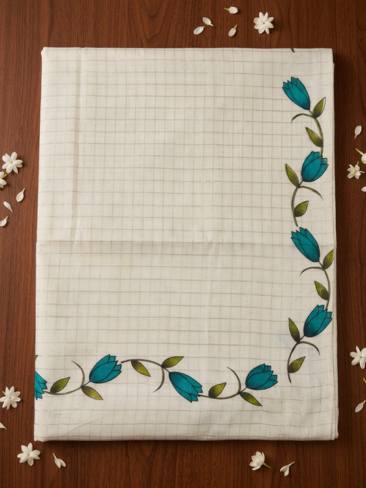 Off-White Cotton Saree with Subtle Micro-Check Weave, Artisanal Teal Floral Vine Motifs, Soft Pastel Lavender Pallu Accent, and Elegant Hand-Knotted Tassels