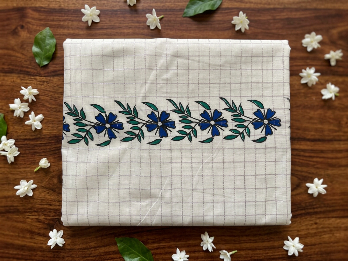 Off-White Cotton Saree with Lavender Micro-Checks, Artisanal Blue Floral Vine Motifs, Soft Purple Pallu Accent, and Hand-Knotted Tassels